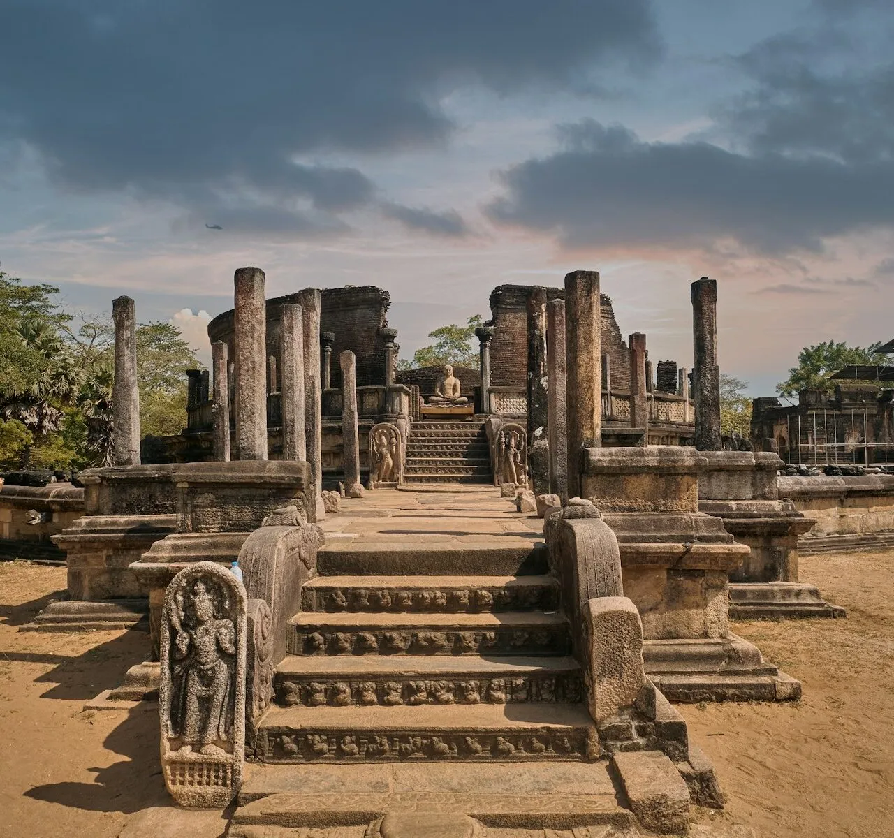 a large stone structure with a statue on top of it