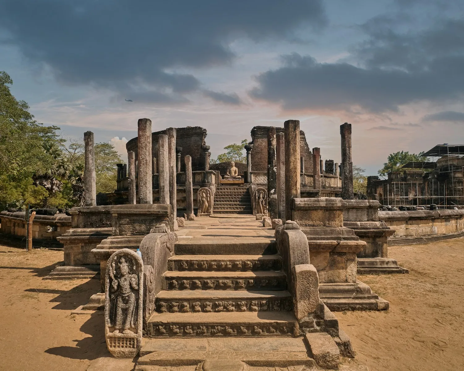 Photo by Birendra Padmaperuma a large stone structure with a statue on top of it