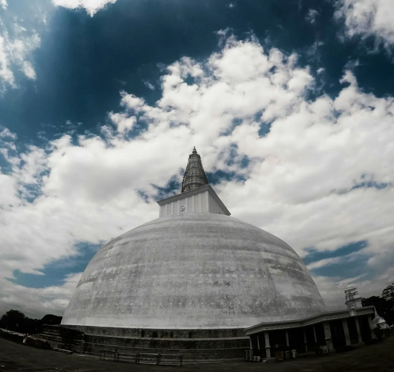 Photo by Tharaka Jayasuriya grey concrete dome building